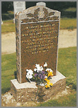 Shown here in Balmoral Red granite with a polished laurel wreath design in relief. Option to have monogram inscribed. 