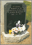 A small stone shown here in Black granite with deep carved rose design in top corners.