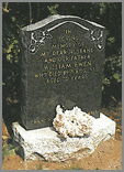 Classic black granite ogee shaped top with flower sandblasted design. Light grey ogee base with centre flower container.