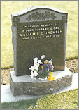 Balmoral Red memorial with sandblasted scroll design with leafed motif design and border. Balmoral red ogee base.