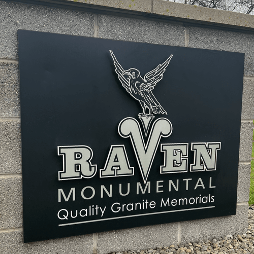 Raven memorial quality granite memorials sign on a brick wall