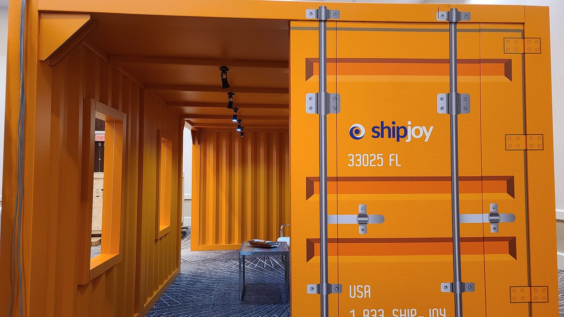 GOKARTON's Custom Cardboard Shipping Container Booth. Immersive Trade Show Meeting Space.