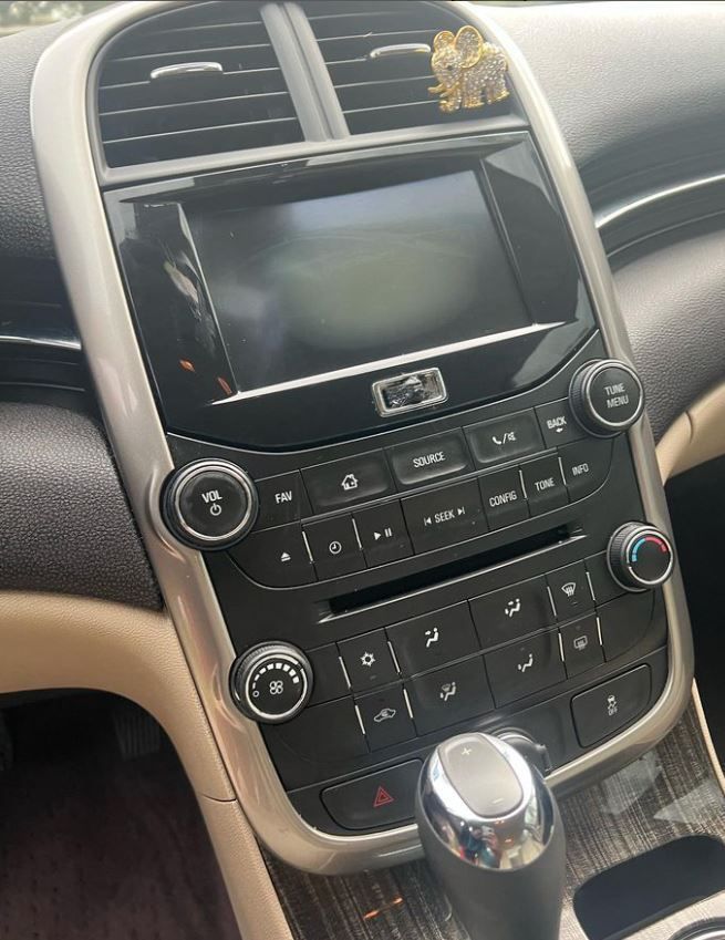 A Close Up of the Dashboard of a Car With a Radio