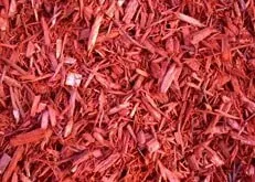 Close-up of red wood mulch chips filling the frame