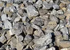 Close-up of gray and tan rocks piled together outdoors