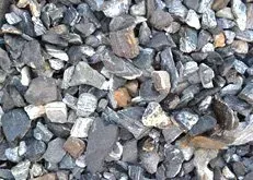 Close-up of small gray, black, and brown rocks and gravel filling the frame