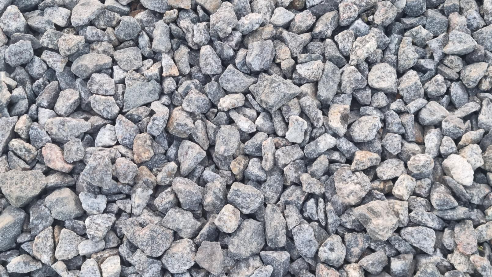 Close-up of small gray gravel stones filling the frame.
