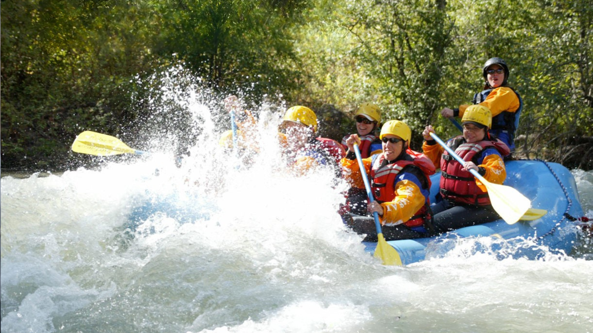 A group of people are rafting down a river.