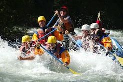 A group of people are rafting down a river.