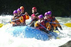 A group of people are rafting down a river.