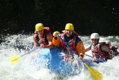 A group of people are rafting down a river.