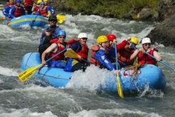 A group of people are rafting down a river.