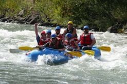 A group of people are rafting down a river.