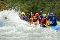 A group of people are rafting down a river.