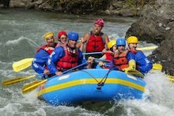 A group of people are rafting down a river.