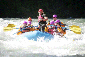 A group of people are rafting down a river.