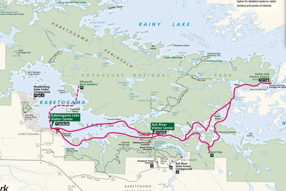 A map of Voyageurs National Park showing a pink boat route connecting Kabetogama Lake to Namakan Lake and Rainy Lake.