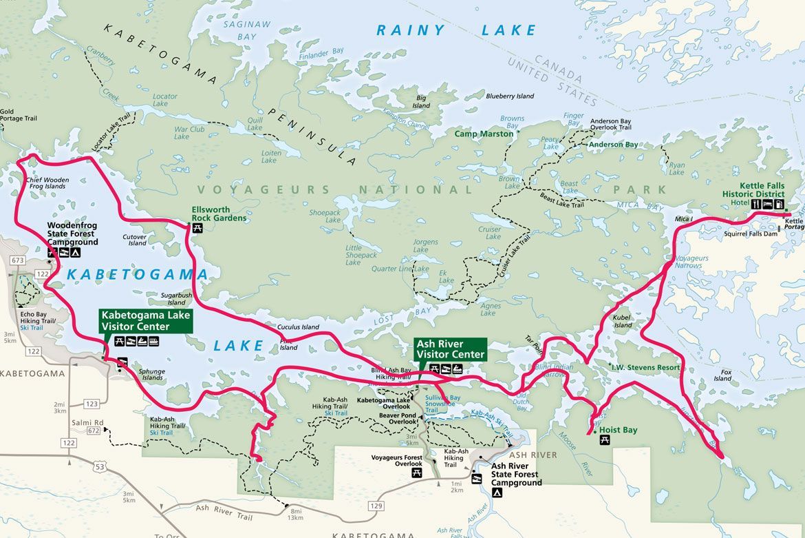A map of Kabetogama Lake showing pink outlined water trails and park facilities against a light green land background.