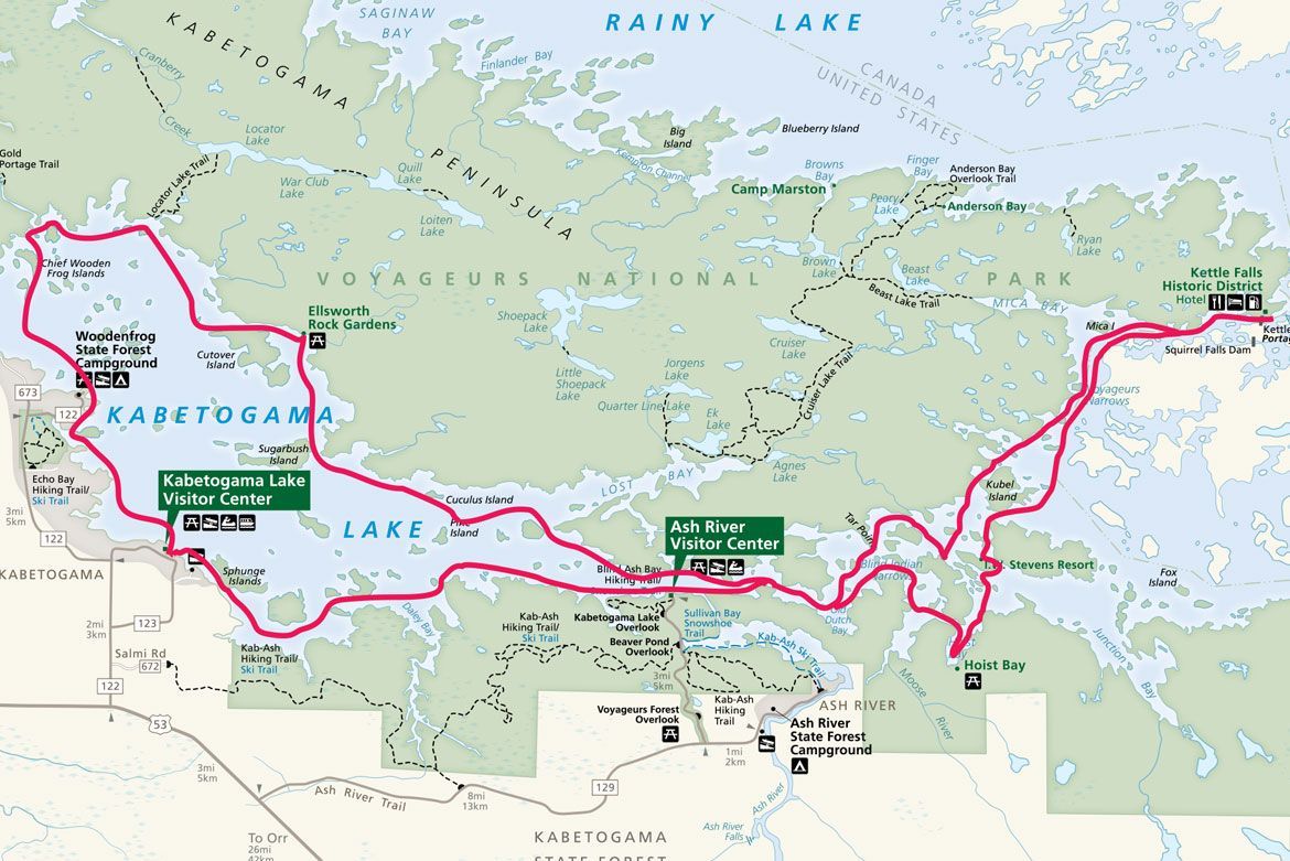 A map of Voyageurs National Park showing a pink outlined snowmobile route across Kabetogama and Namakan lakes.