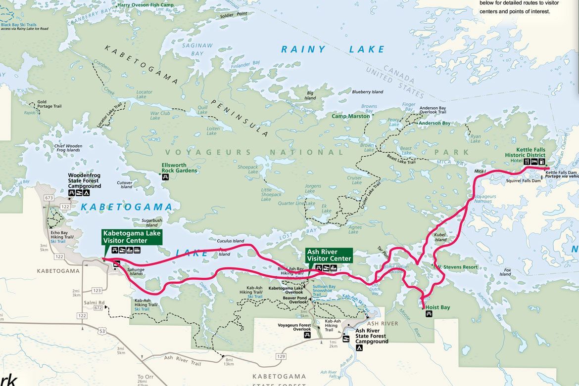 A map of Voyageurs National Park, featuring Kabetogama Lake, Rainy Lake, and a pink trail route marked across the area.