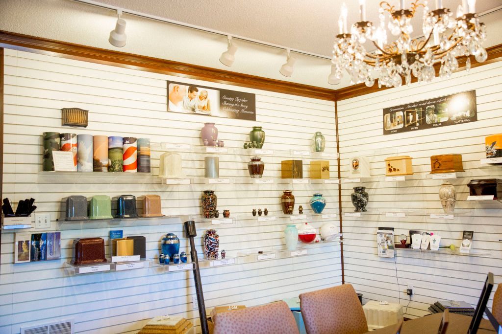 A room with a lot of shelves and a chandelier.
