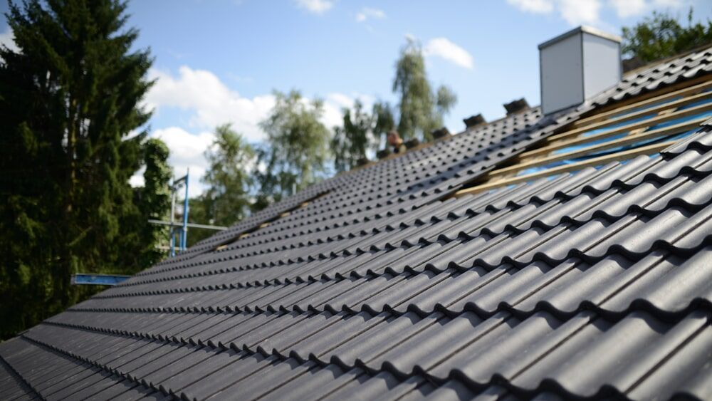 Roof Tiles in Grey Metallic Colour — Roofing Repair in Kincumber, NSW	