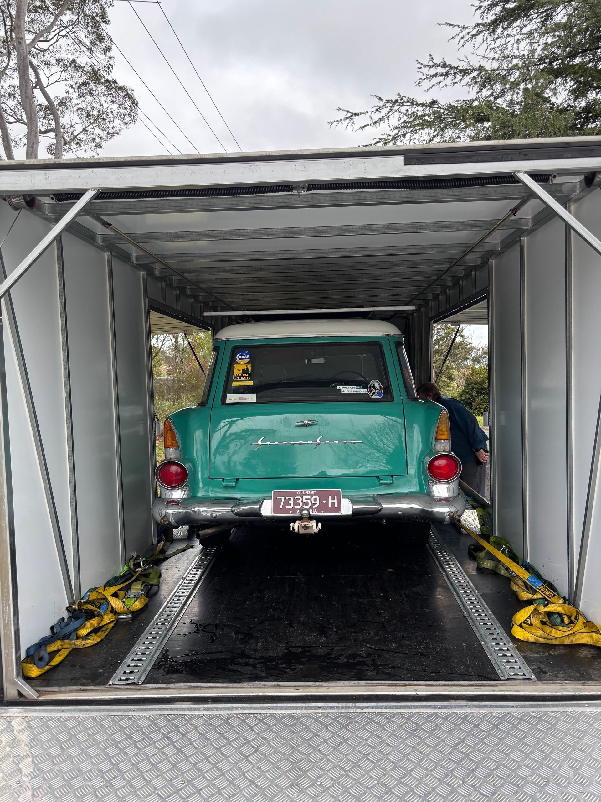 Mint-green vintage car inside an automatic car wash bay - Full Throttle Enclosed Car Transport in Kilmore, VIC