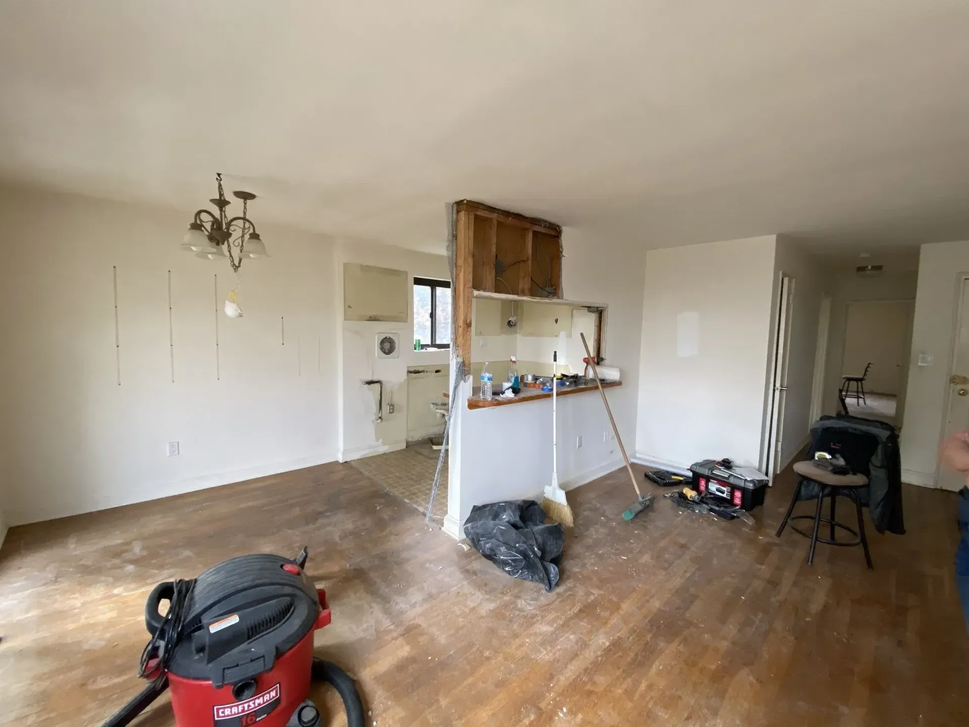 There is a vacuum cleaner in the middle of the room.