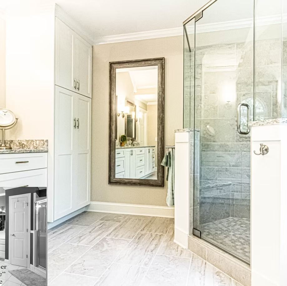Bright bathroom with glass shower, double sink vanity, and large wall mirror in a light neutral design