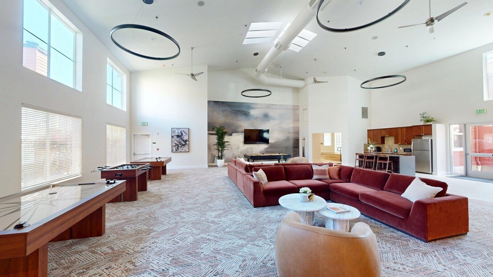 Resident lounge with media areas, gaming, pool table, shuffle board, air hockey.