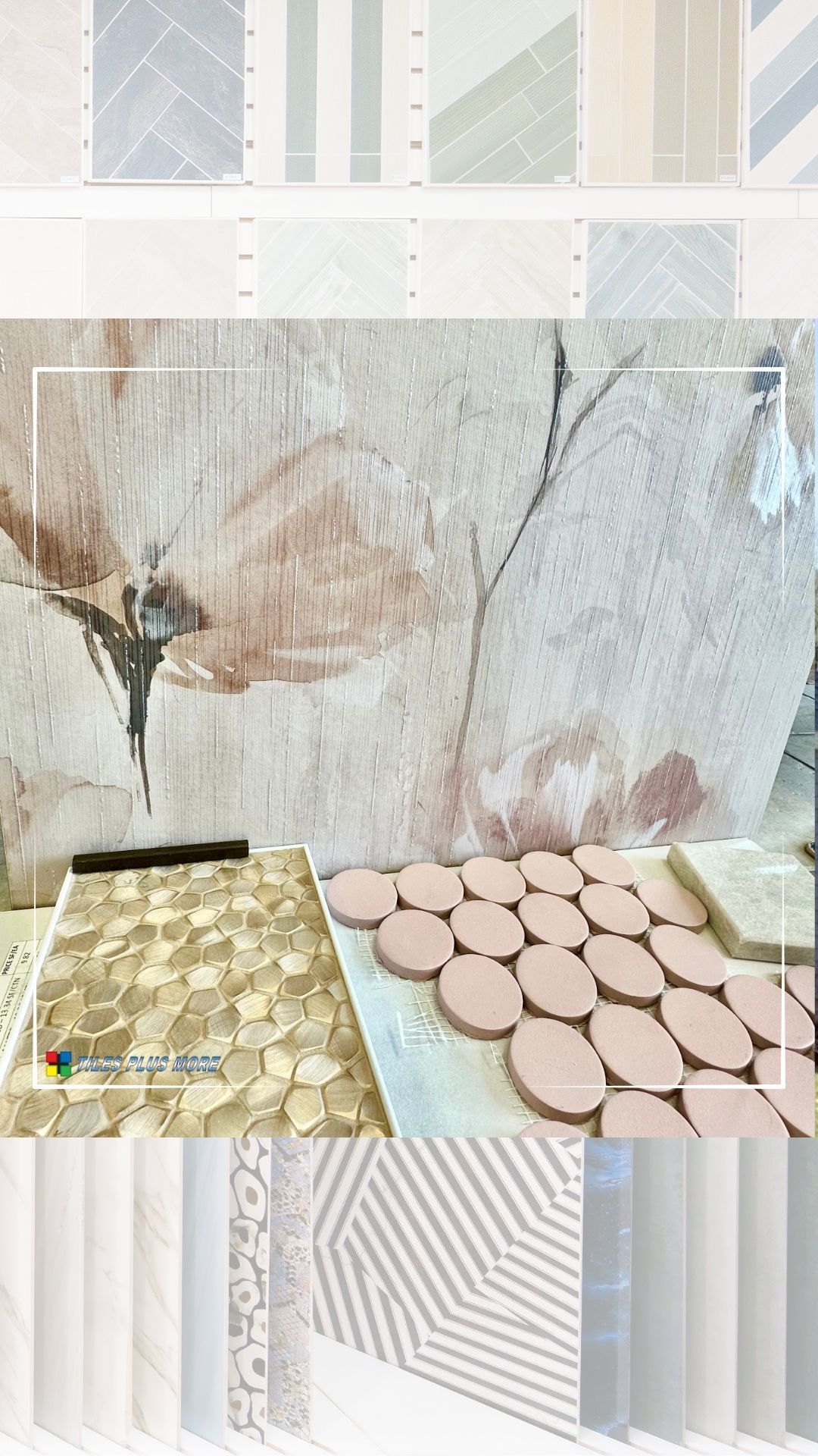 Pastel bathroom tiles and patterned wall panels displayed in a showroom, with sample tiles on a table.