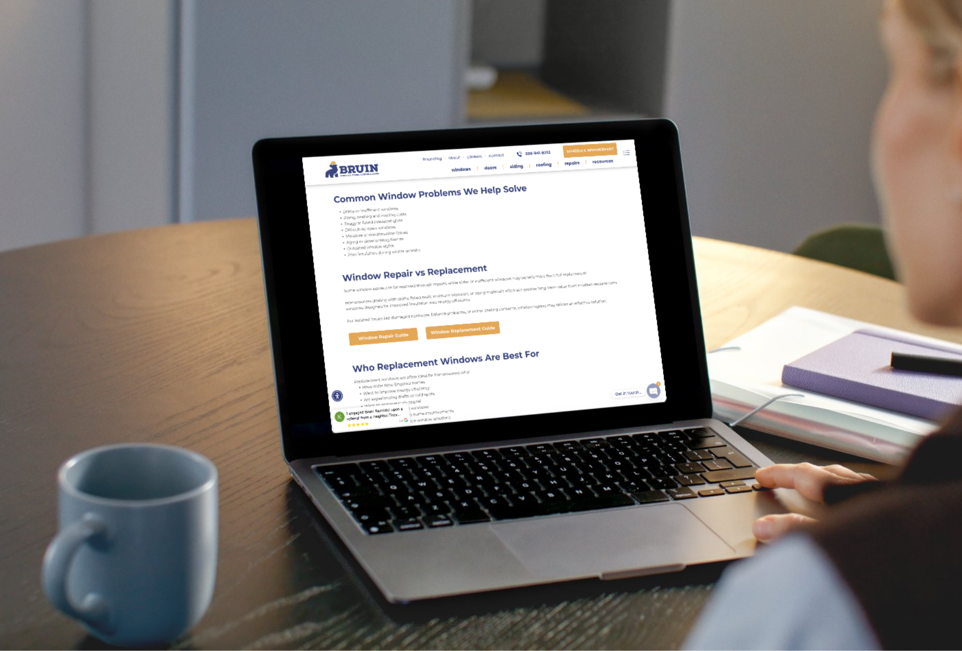 A person browsing the Bruin Exteriors website on a laptop showing a well structured service page