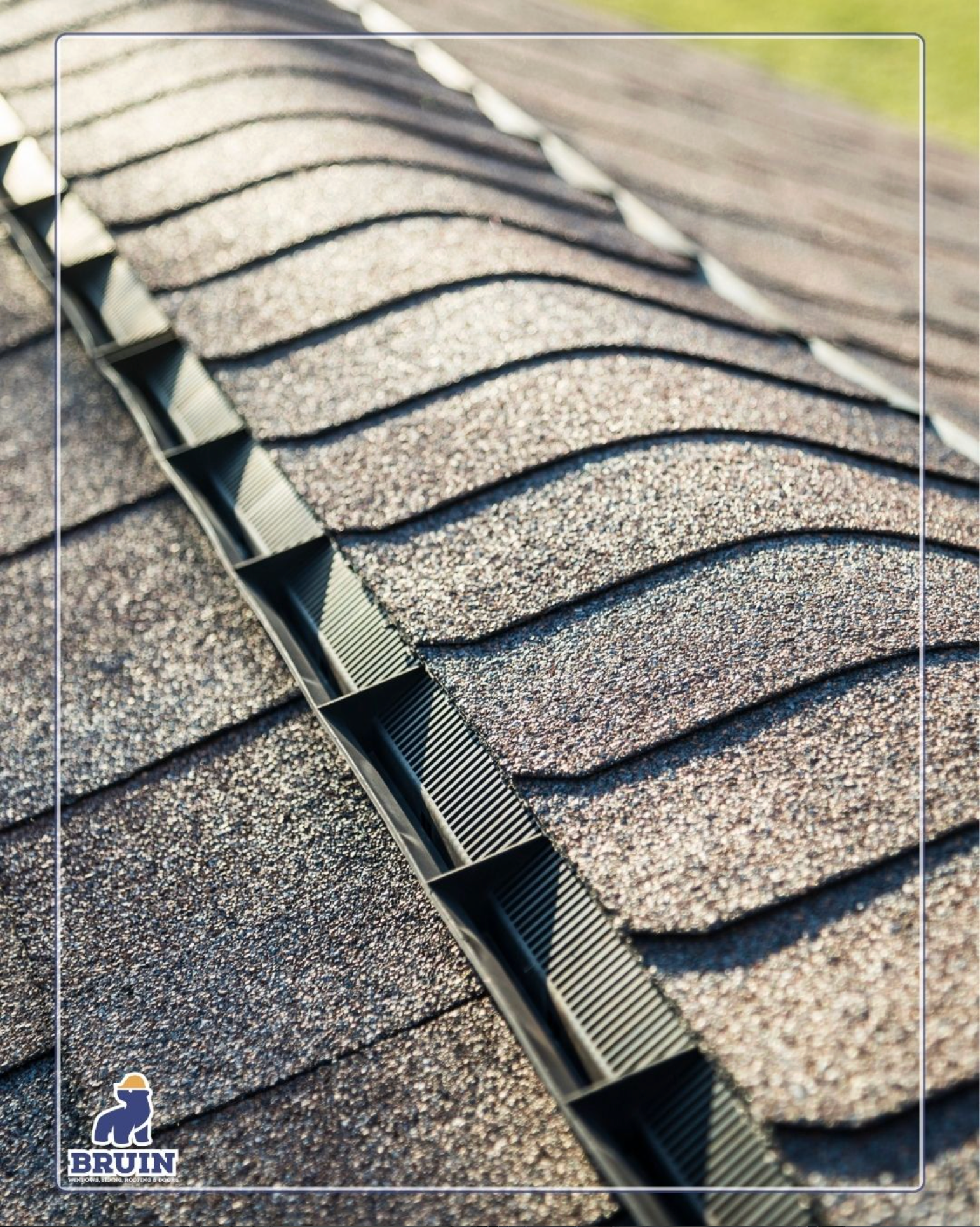 Close-up of a shingled roof with a row of exposed ridge vent openings.