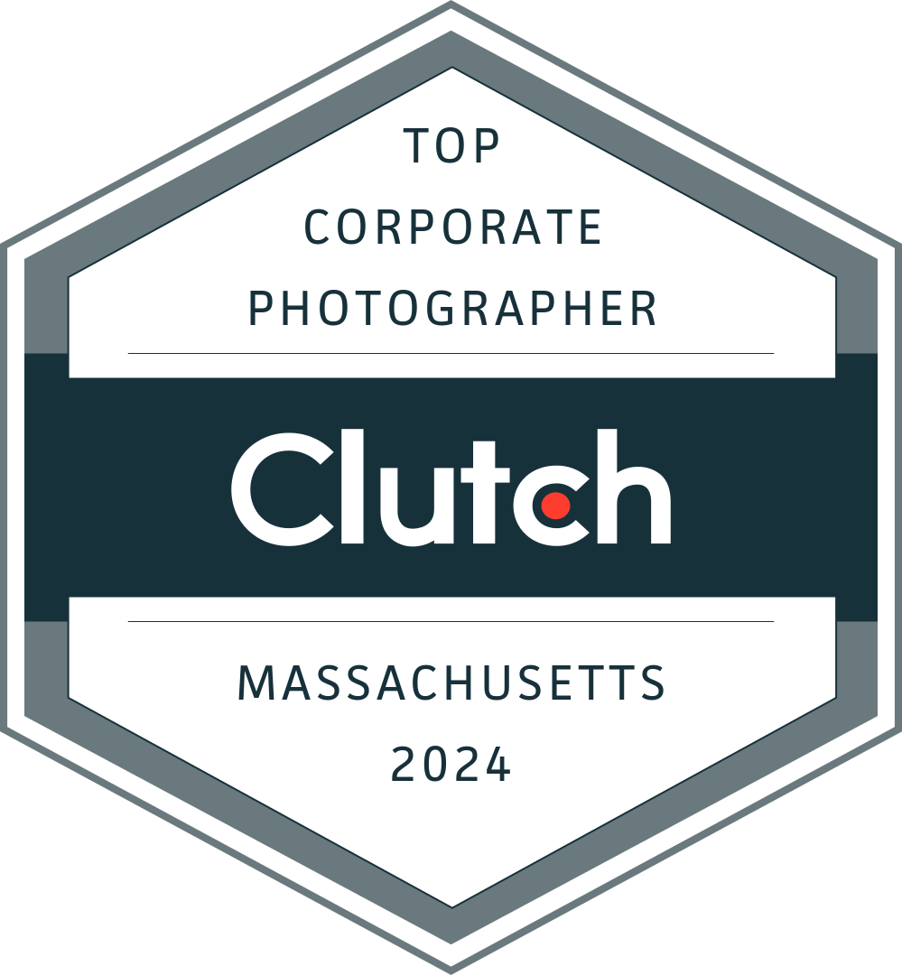 Clutch badge: Top Corporate Photographer, Massachusetts 2024, gray hexagon with teal center