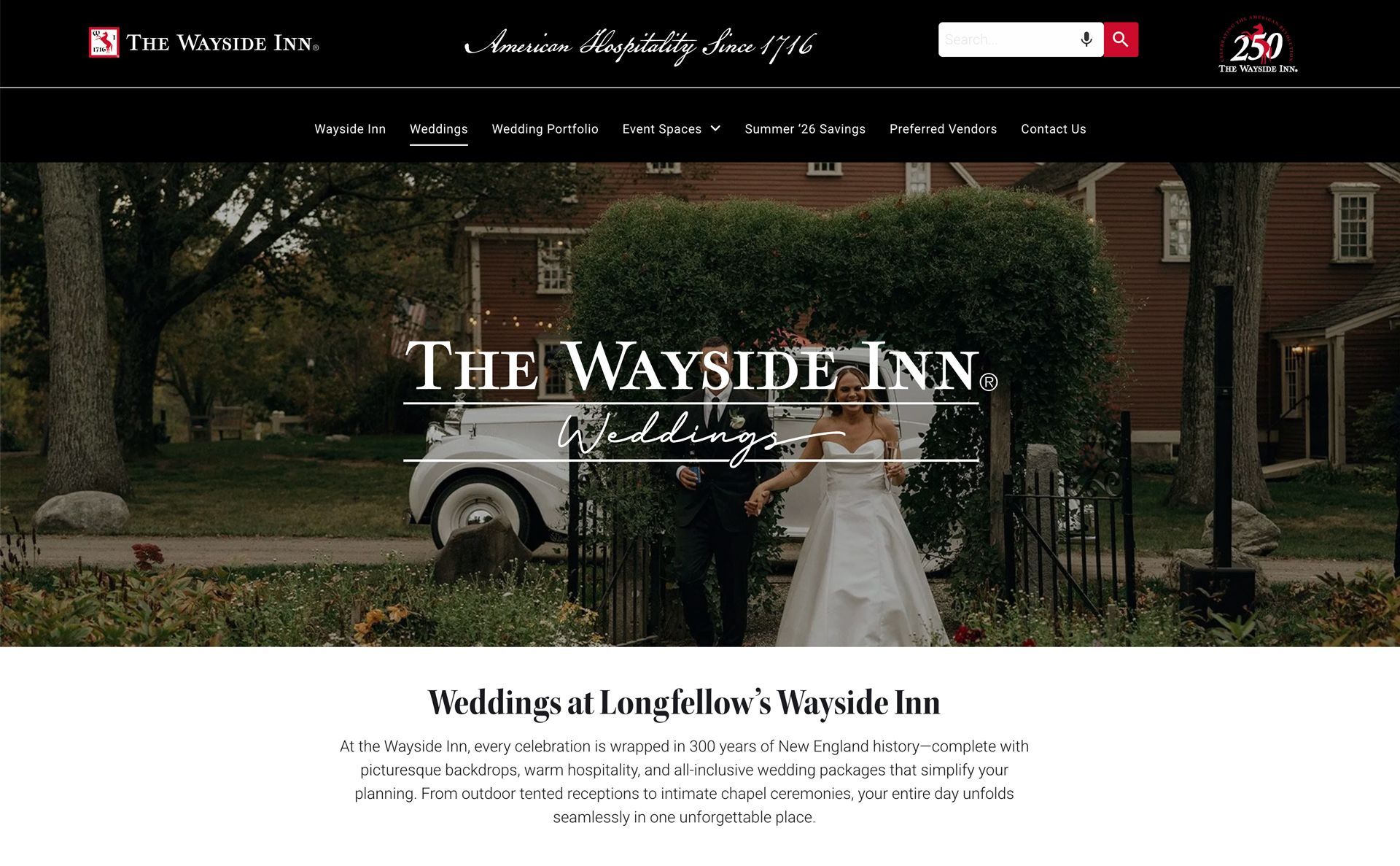 Wedding couple beside vintage car at The Wayside Inn, a brick inn with lush garden backdrop