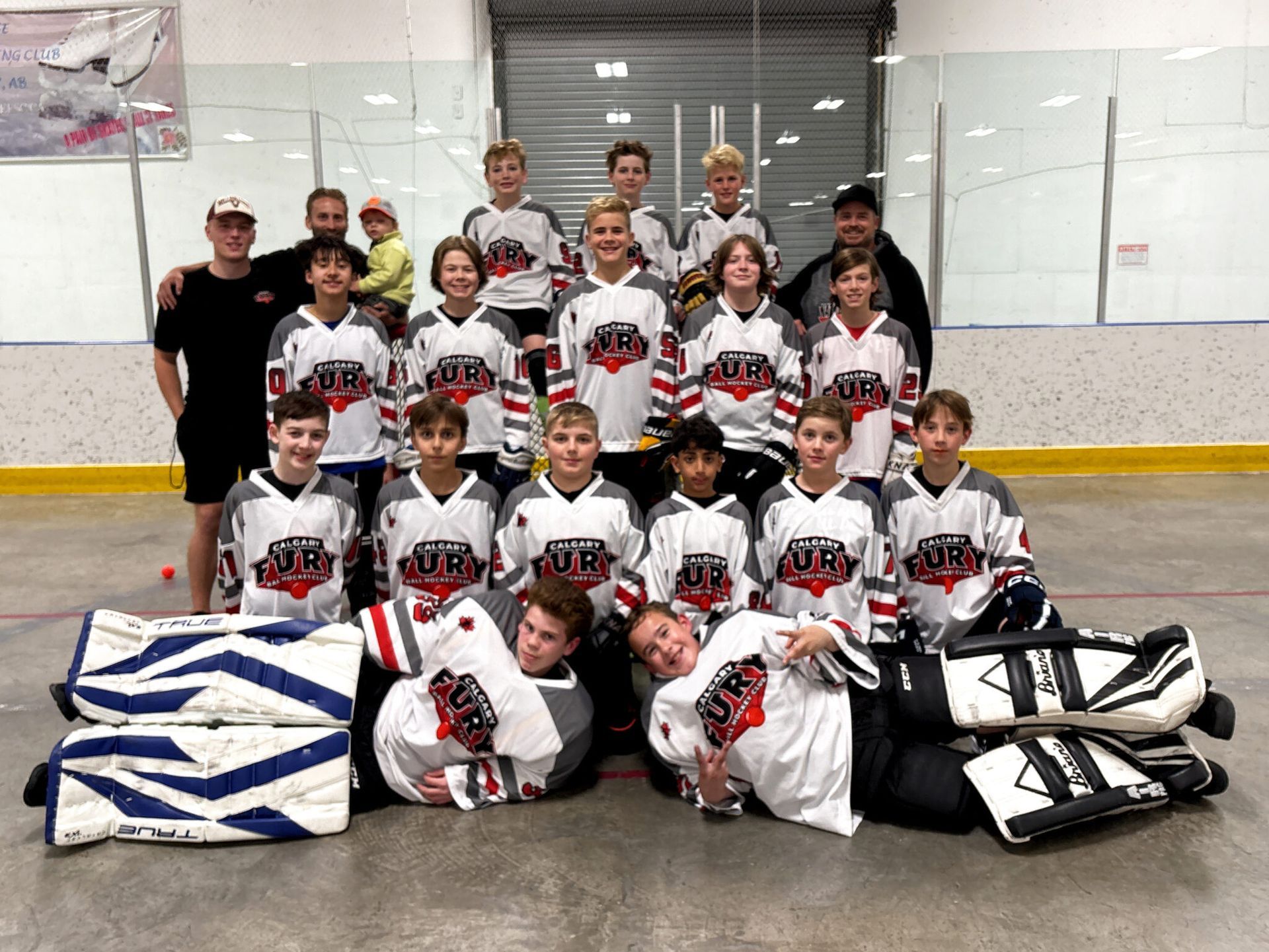 U13A Fury ball hockey team group photo wearing white jerseys