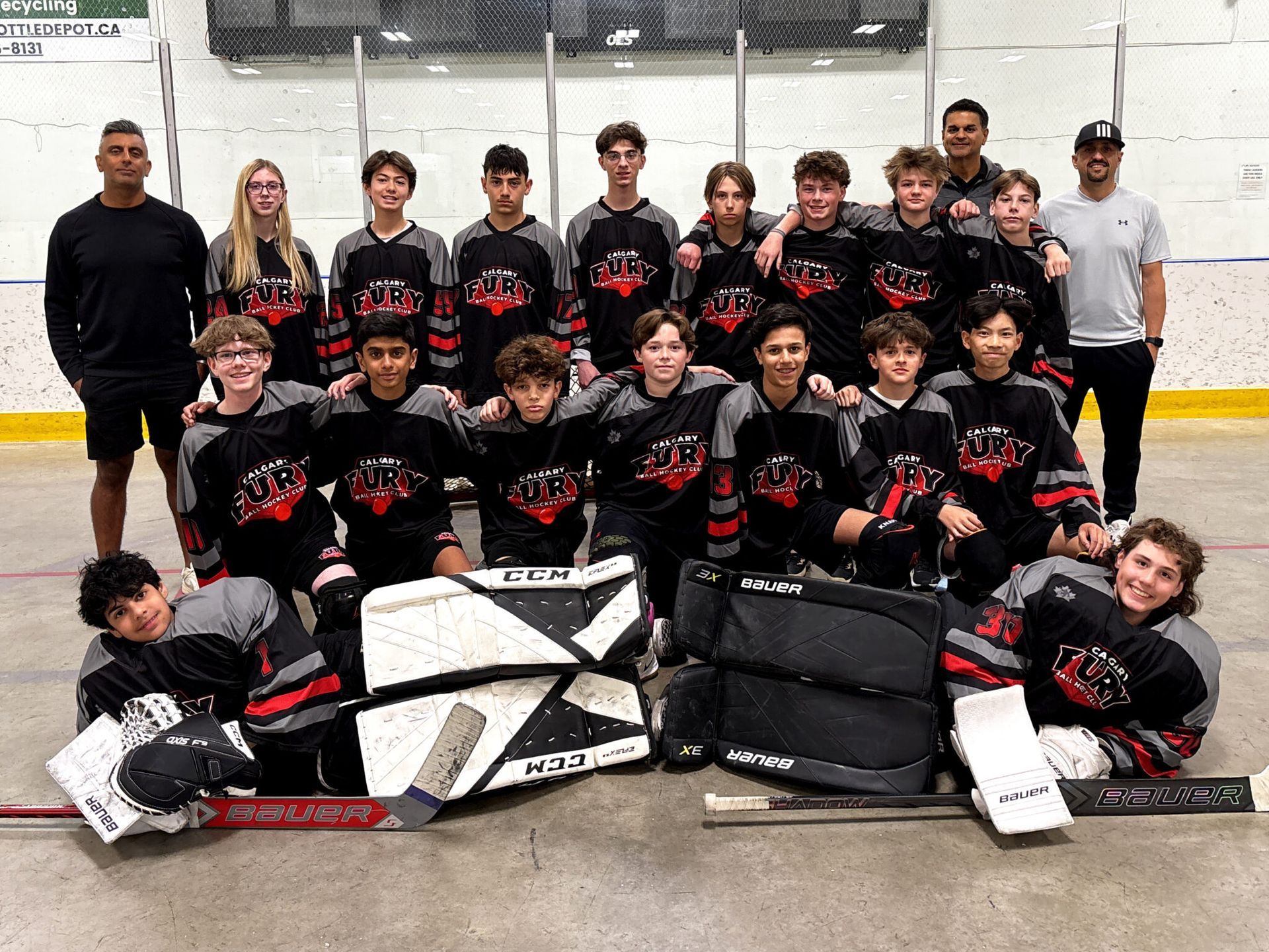 U15B Fury ball hockey team group photo wearing black jerseys