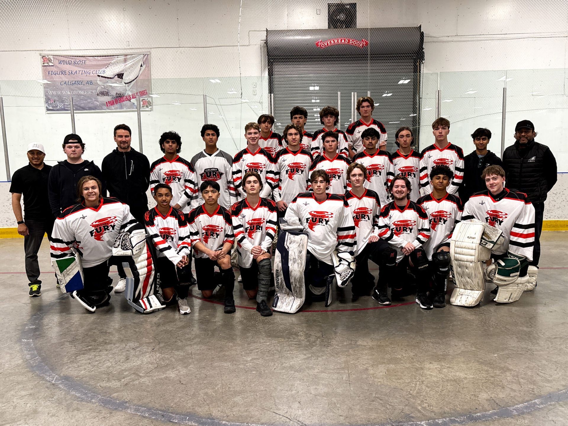 U18 Fury ball hockey team group photo wearing white jerseys