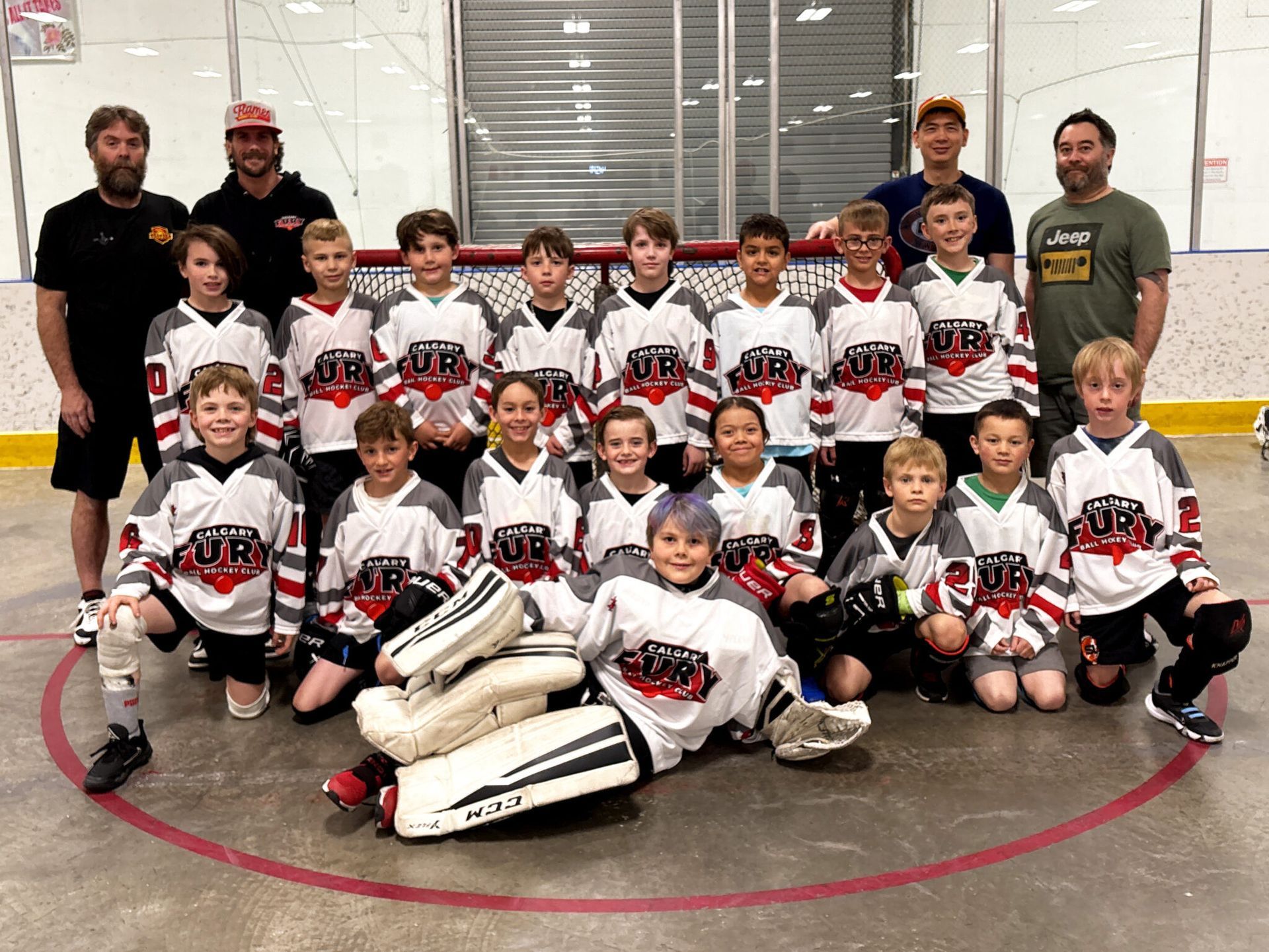U9 Fury ball hockey team group photo in white jerseys