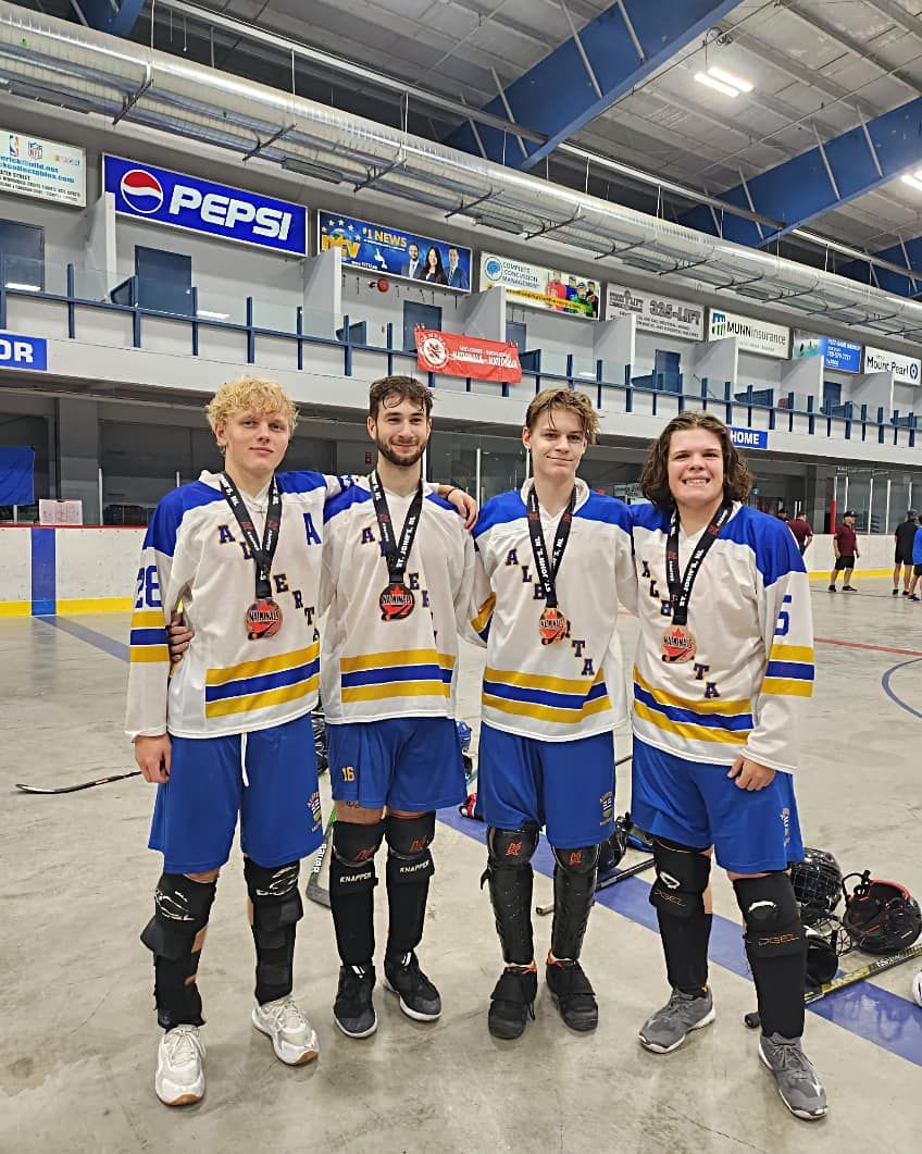 2023 Junior Nationals Team Alberta group of 4 players after winning a medal
