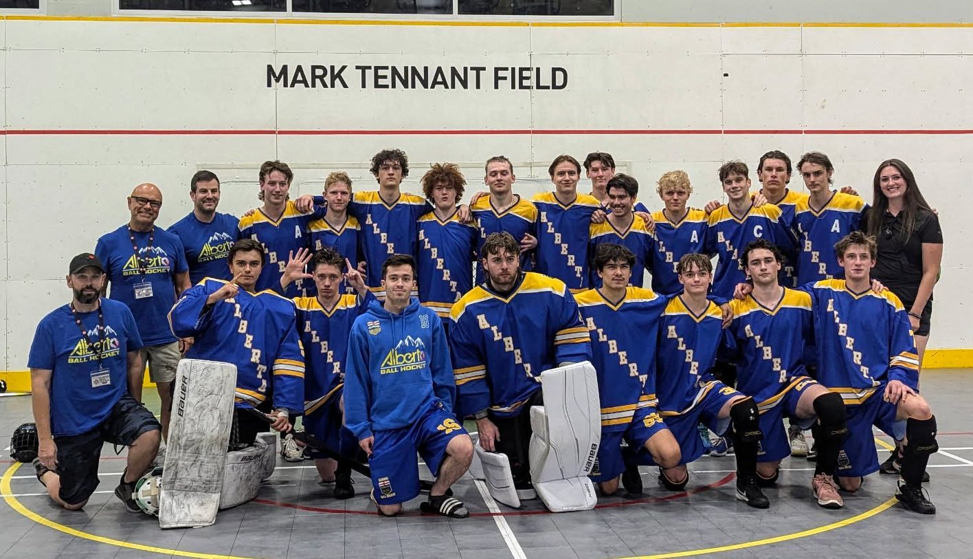2024 U19 Junior Nationals Team Alberta group photo wearing blue jerseys after a game