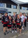 The Stang family at the 2025 U20 Mens ISBHF World Championships after winning a gold medal, posing with the trophy