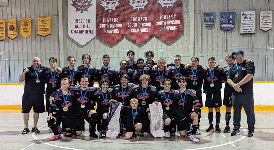 2022 U19 Junior Nationals Fury ball hockey team wearing balck jerseys after a game