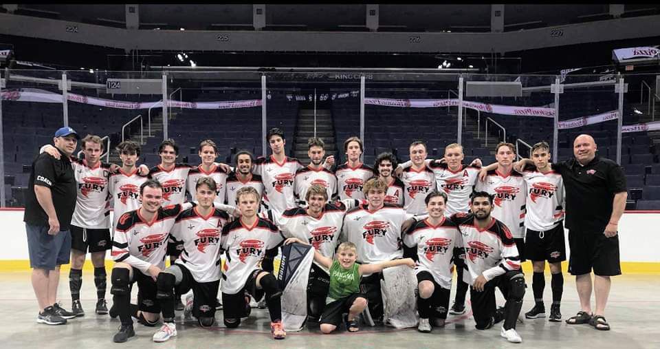 2022 U19 Junior Nationals Fury team group photo wearing white jerseys after a game