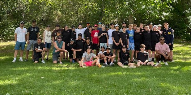 A Fury team group photo at a tournament, outside in casual clothing