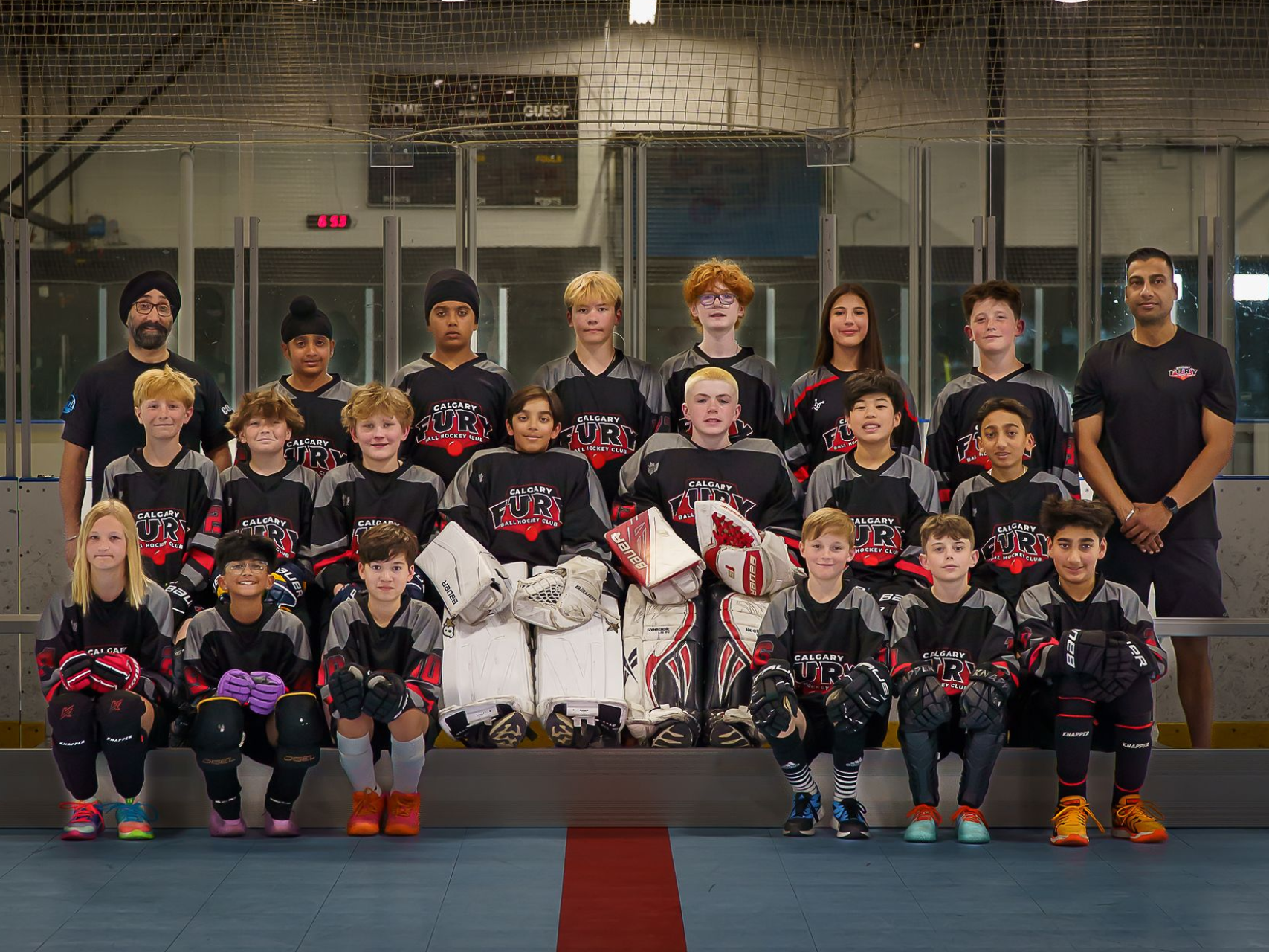 U13B Fury ball hockey team group photo wearing black jerseys
