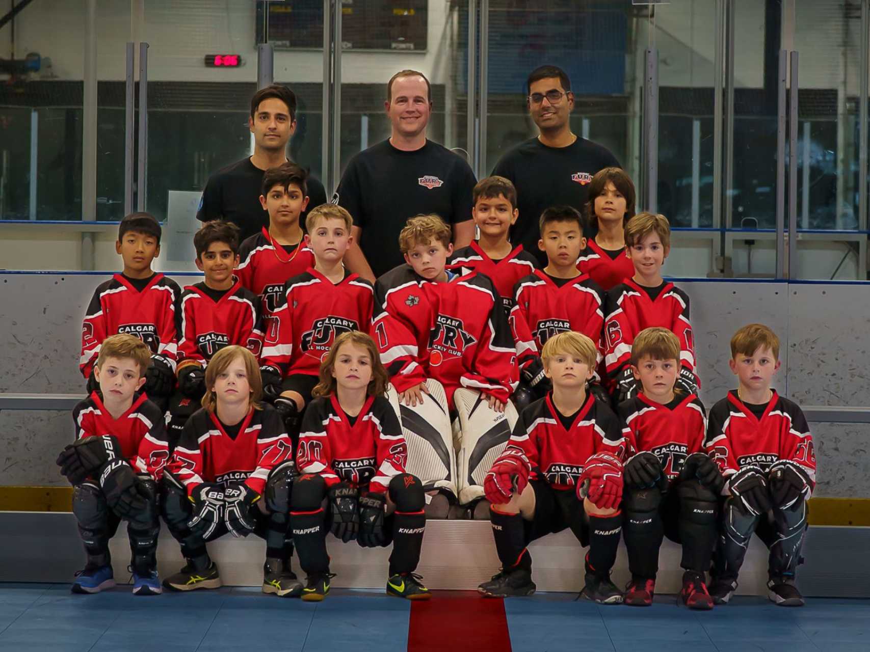 U9 Fury ball hockey team group photo in white jerseys