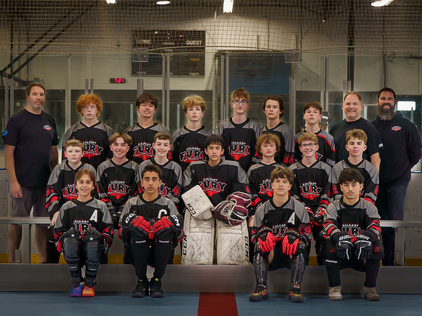U9 Fury ball hockey team group photo in white jerseys
