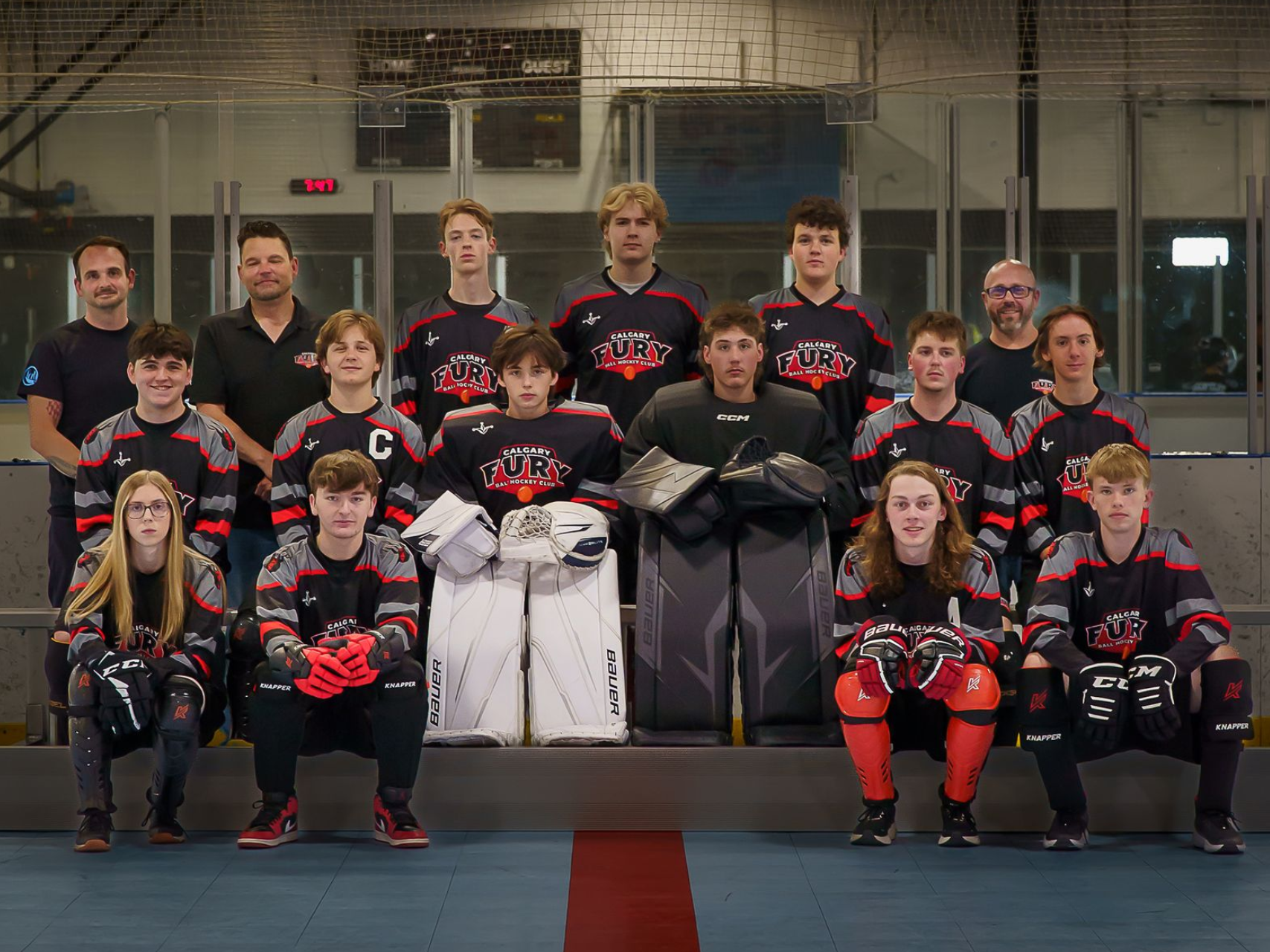 U11B Fury ball hockey team group photo wearing black jerseys