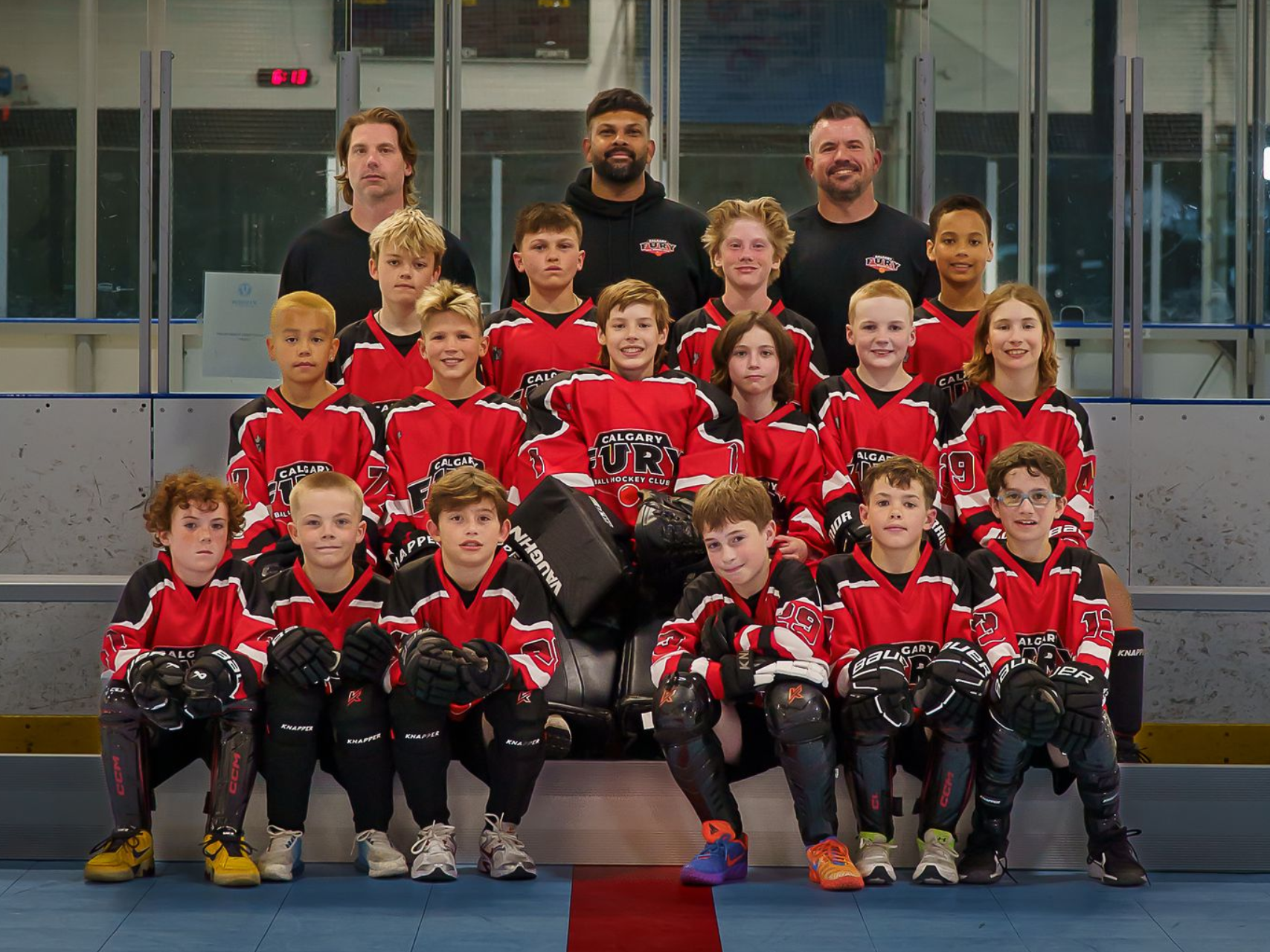 U11A Fury ball hockey team group photo wearing white jerseys
